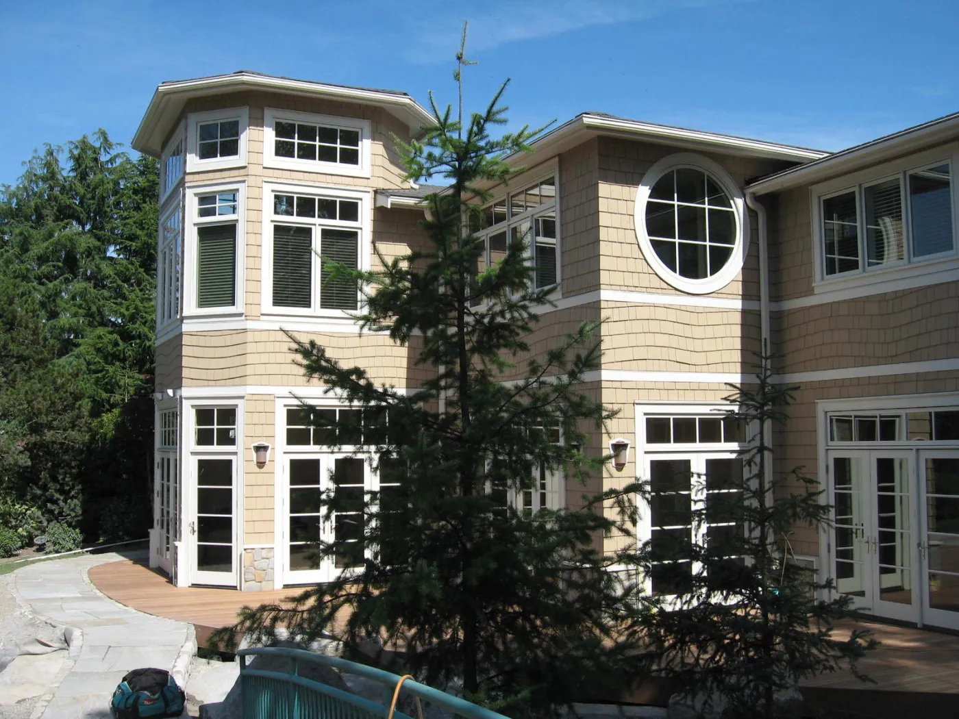 Bellevue home from the side, tower bay and round window